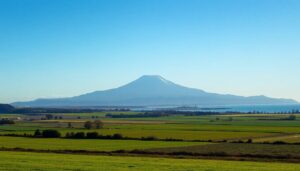 Taranaki coastal farmland with the mountain and a gas facility
